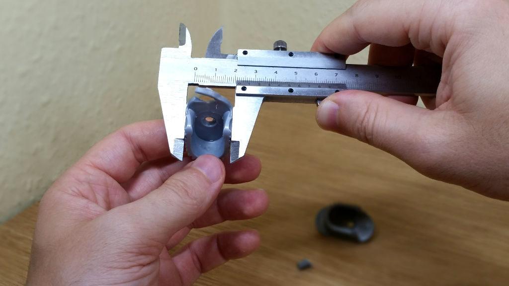 Measuring Broken Wardrobe Rail Bracket With Caliper