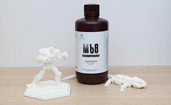 Bottle of White Resin and 3D Prints