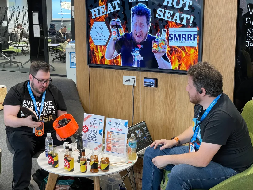 Anthony from Prusa demonstrating a remote-controlled filament spool during the Heat in the Hot Seat show hosted by Grant at SMRRF 2026