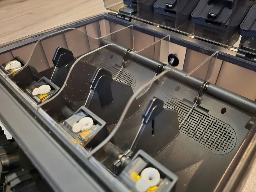 Top-down view of the EIBOS Series X Tetras interior showing installed feed baffles and middle acrylic dividers that separate each filament drying bay.