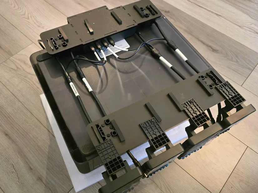 Bottom view of the EIBOS Series X Tetras showing installed power and screen modules with cable connections secured to the AMS support frame.