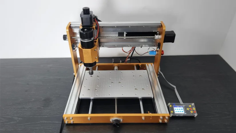 Front view of the Lunyee 3018 Pro Ultra CNC machine with aluminum frame, 500W spindle, and offline controller, positioned on a dark wooden surface.