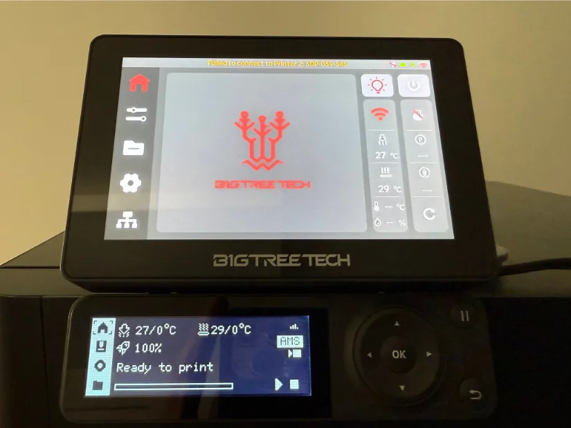 BIGTREETECH Panda Touch 5-inch touchscreen clipped onto its magnetic dock above the stock Bambu Lab P1S control panel, showing the BigTreeTech logo and home-screen icons.
