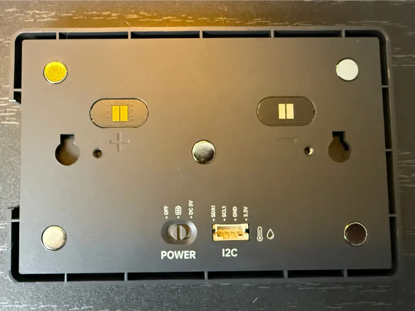 Back side of the BIGTREETECH Panda Touch screen displaying two pogo-pin charge pads, four neodymium magnets, a power-mode selector (OFF/USB/DC 5 V), and a labeled I2C breakout header