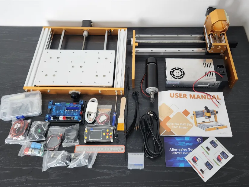 Lunyee 3018 Pro Ultra CNC machine components laid out for assembly, including aluminum frame parts, spindle motor, power supply, electronic control board, touchscreen offline controller, and user manuals.