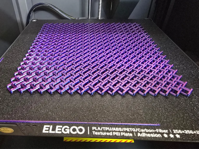 Chainmail 3D printed fabric on the Elegoo Centauri Carbon's textured PEI build plate using dual-color PLA