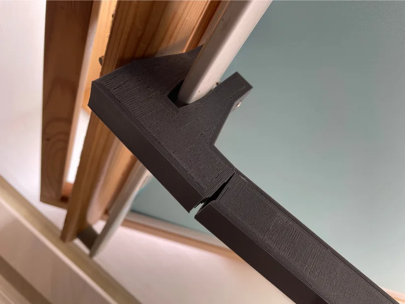 Broken 3D printed roof window handle extension made from PLA after long-term heavy use