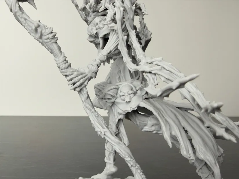 Side view of Nerikson Famine Horseman standalone resin print—tattered robes, skull emblem, and staff hand—unpainted gray, produced on Piocreat HALOT-X1 16K printer