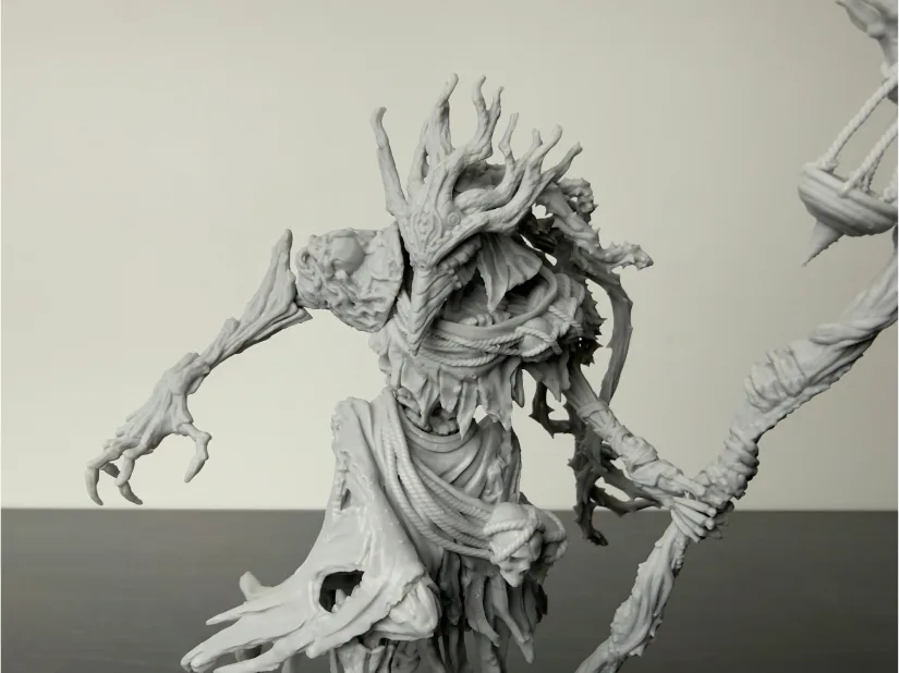 Close-up of Nerikson Famine Horseman standalone resin figure—tendril mask and wrapped robes—unpainted gray, printed on Piocreat HALOT-X1 16K resin 3D printer