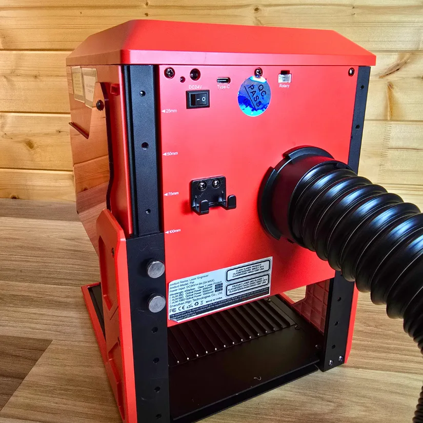 Algolaser Pixi raised on extended fixtures with exhaust hose connected to the rear vent