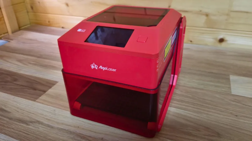 Compact Algolaser Pixi 5W smart laser engraver with enclosure and touchscreen on workbench
