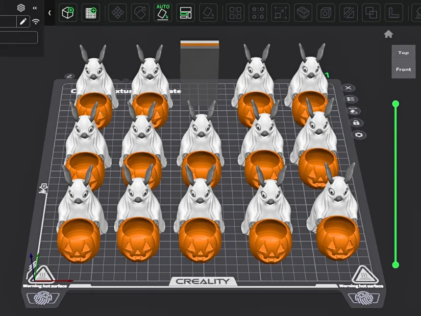 Batch of bunny figurines with pumpkin baskets arranged for 3D printing on the Creality K2 Pro build plate