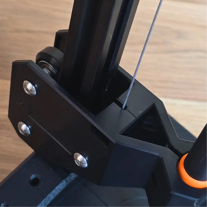 Inserting the retractable cord into the V-slot on the Mintion Heat Press