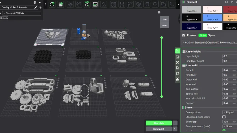 Screenshot of CrealityPrint software showing a large project with multiple build plates arranged by part type, color, and material.