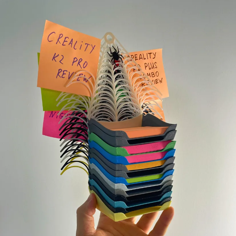 Stack of multicolour Halloween-themed spiderweb note holders
