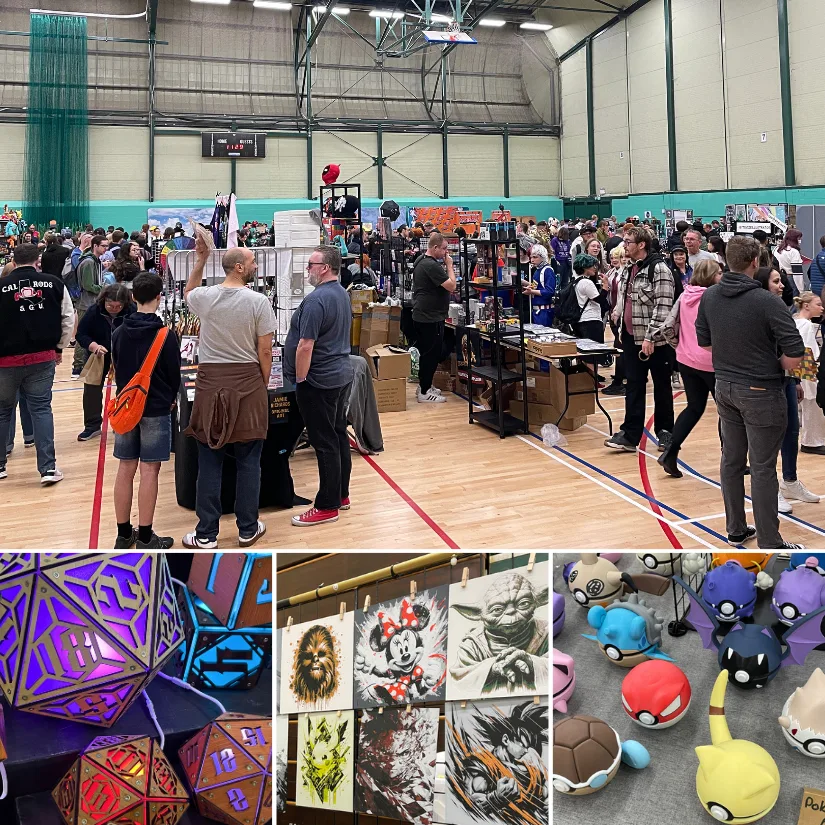 Local Comic Con event in a sports hall, featuring crowd-filled vendor booths, tabletop dice, fan art prints, and Pokémon-style collectibles.
