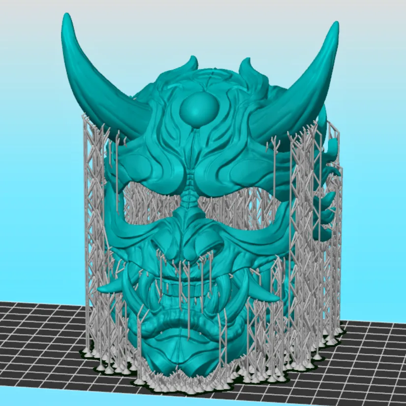 Oni mask model with auto-generated supports shown in the Uniformation Slicer preview