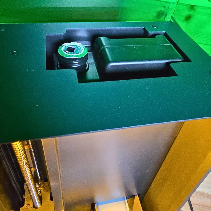 Top-loading resin feed port of the Uniformation GK3 Pro designed for automatic resin supply