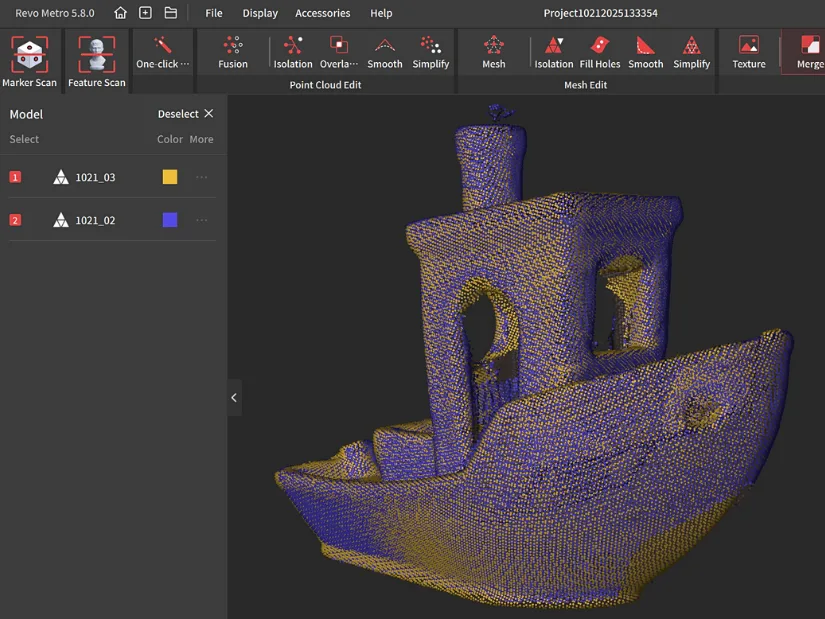 Two overlapping Benchy scans displayed as dense point clouds in Revo Metro, showing yellow and blue point sets before merging.