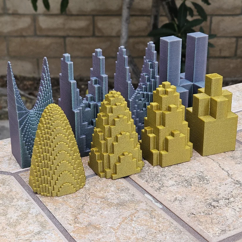 3D printed circular and hyperbolic paraboloids built from stacked rectangular prisms, illustrating volume approximation in double integrals