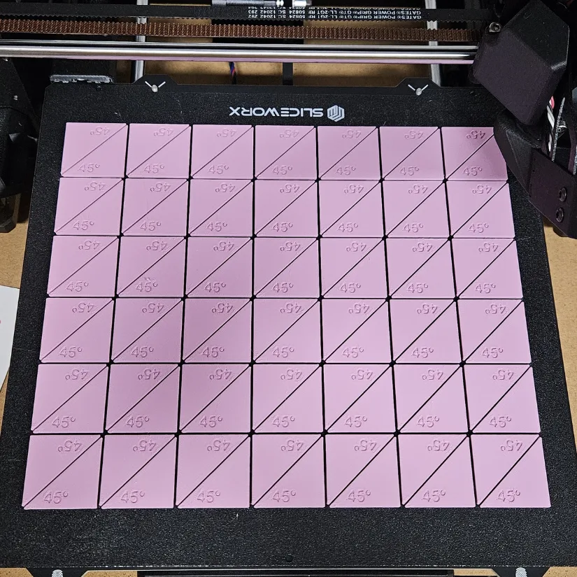 Multiple 3D printed unit circle triangles arranged in a grid on a build plate, showing efficient batch printing for classroom sets