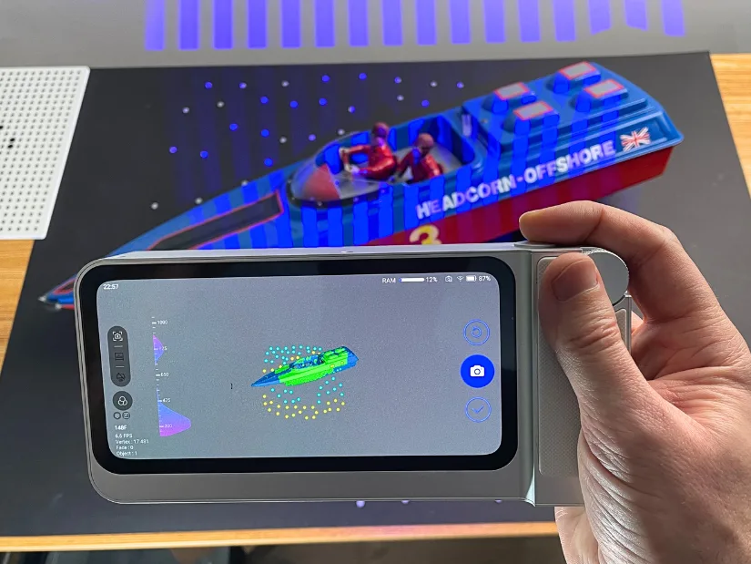 Toucan handheld 3D scanner capturing an RC boat model in Marker Far Mode with Single Shot scanning