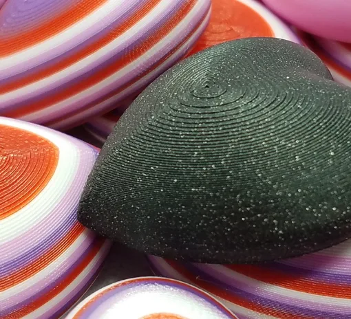 3D printed Valentine heart magnets prepared for classroom Valentine exchanges