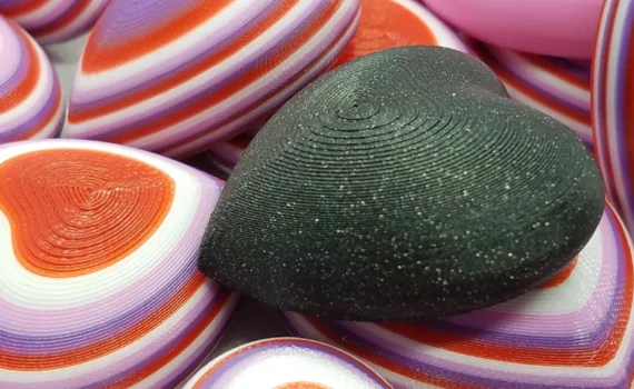 3D printed Valentine heart magnets prepared for classroom Valentine exchanges