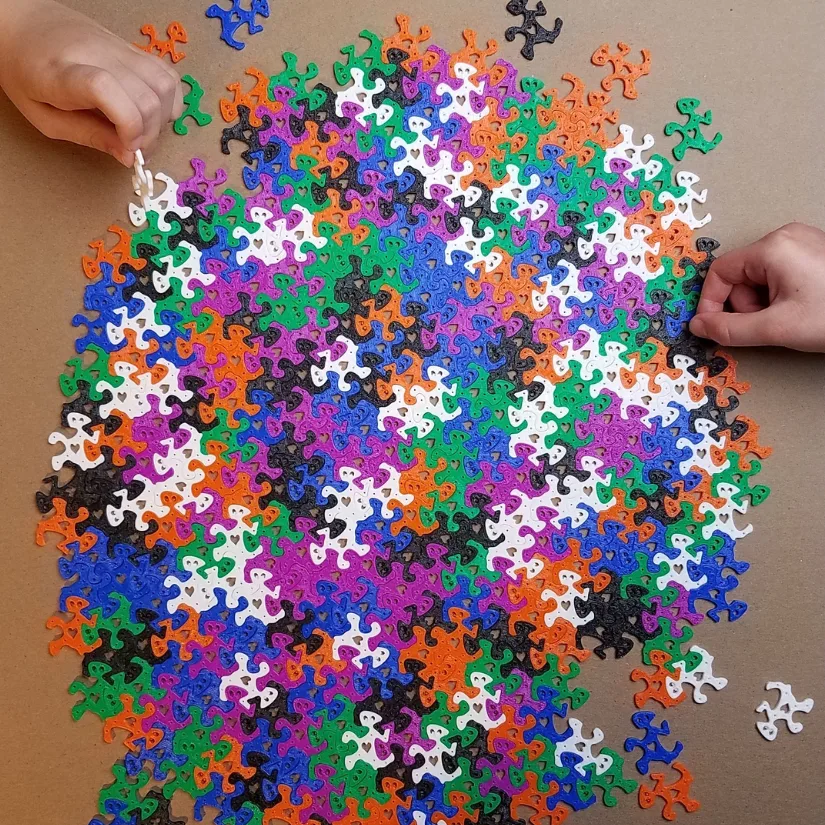 3D printed heart tessellation pieces assembled and played with by students during a classroom Valentine exchange