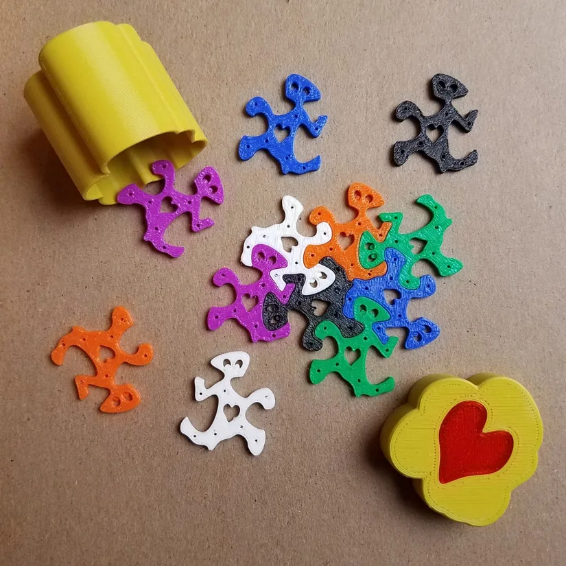 3D printed heart tessellation pieces stored in a custom 3D printed box for classroom Valentine activities