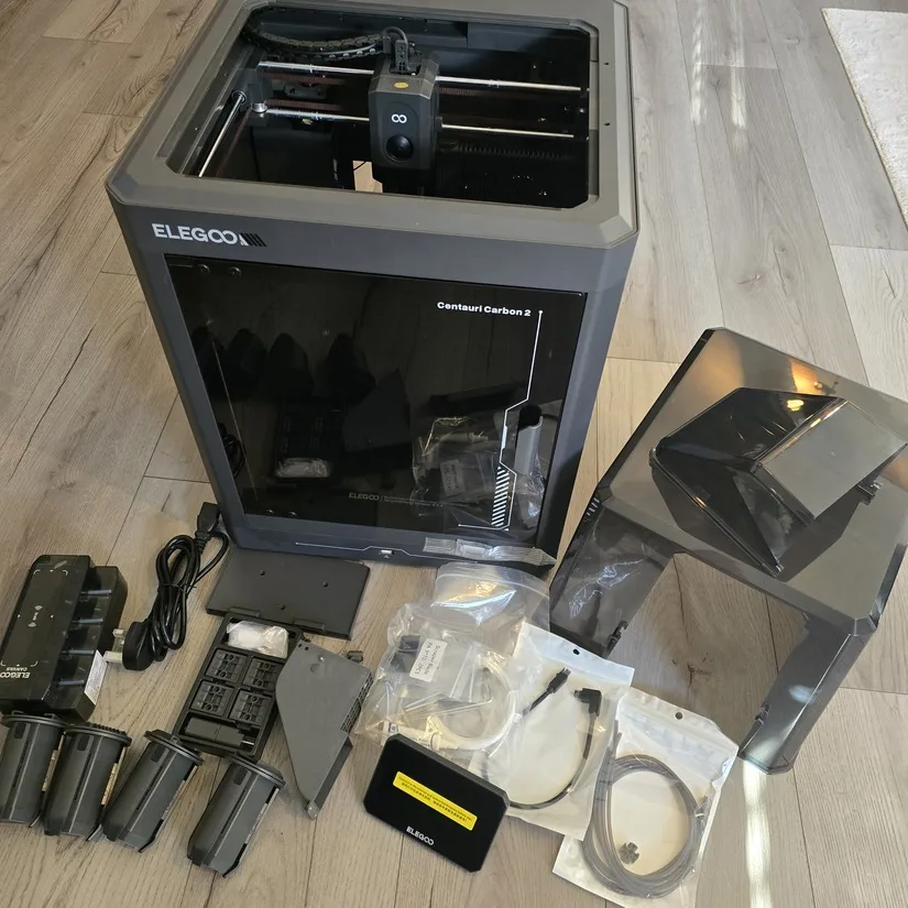 Printer accessories and parts laid out after unboxing