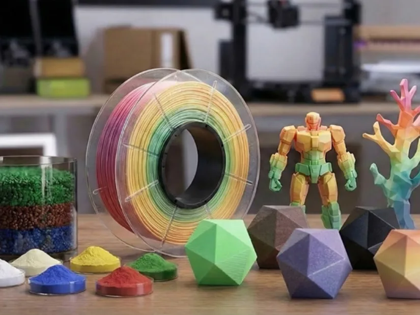 Custom color filament spool with pellets and 3D printed models created using the Creality filament-making workflow