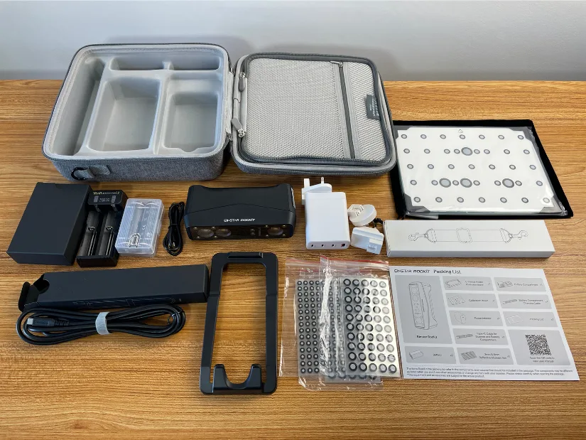EINSTAR Rockit 3D scanner accessories including carrying case, calibration board, markers, cables, and power adapter