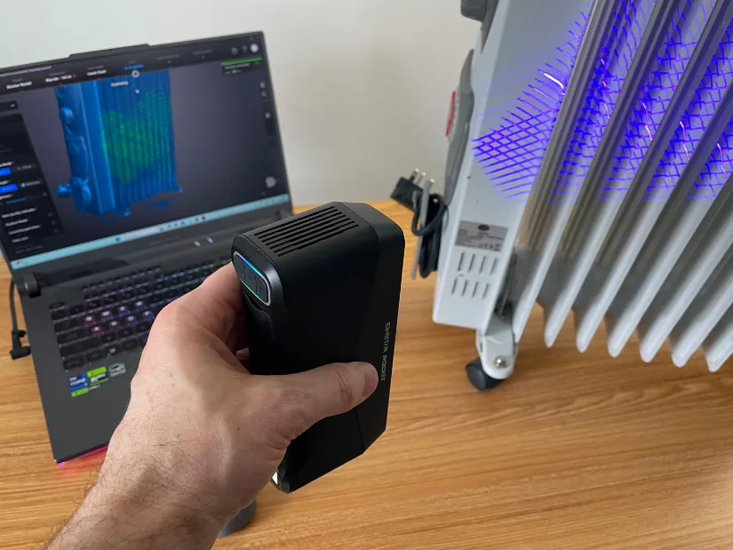 EINSTAR Rockit scanning a portable radiator in blue laser mode with EXStar Hub preview on laptop