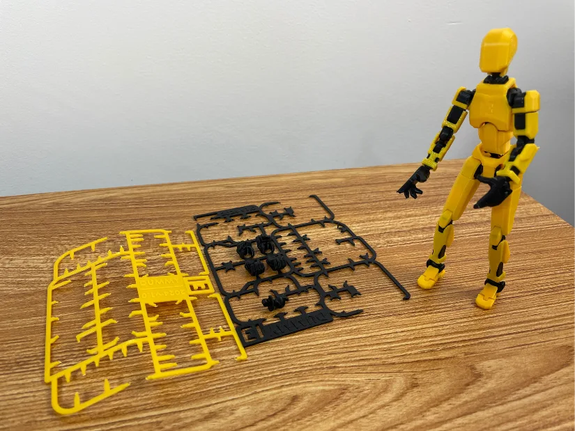 Dummy 13 model assembled from kit card parts next to printed frames