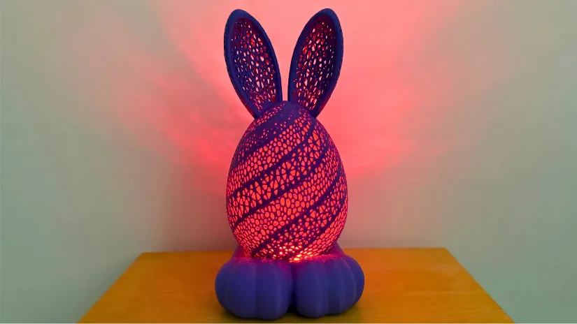3D printed Easter bunny egg lamp with perforated pattern and LED light