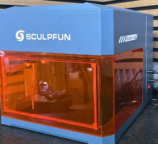 Sculpfun iCube Ultra enclosed laser engraver on a workbench