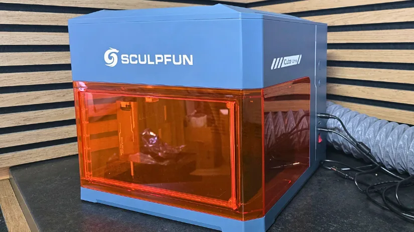 Sculpfun iCube Ultra enclosed laser engraver on a workbench