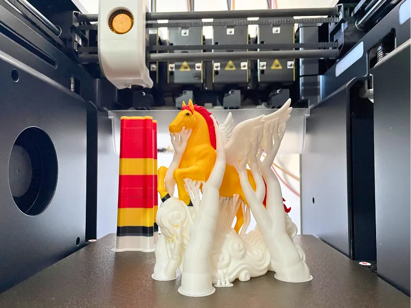 Multicolor Pegasus 3D print with supports showing the structure that easy to remove