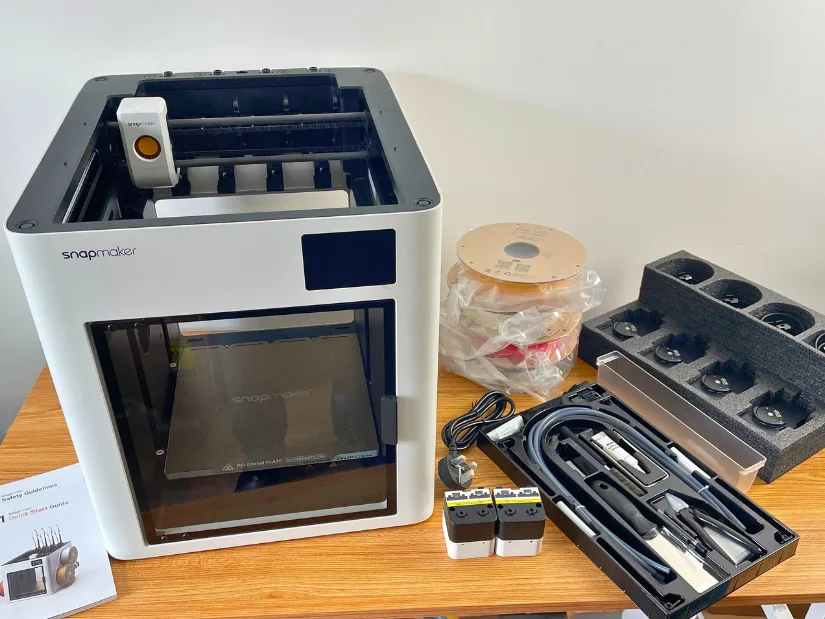 Snapmaker U1 3D printer with included accessories, toolheads, filament spools and tool kit