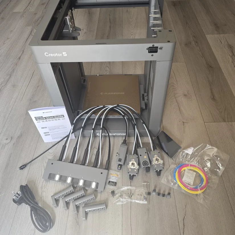 Flashforge Creator 5 box contents Flashforge Creator 5 box contents with printer frame, toolheads, spool holders, cables, and accessories