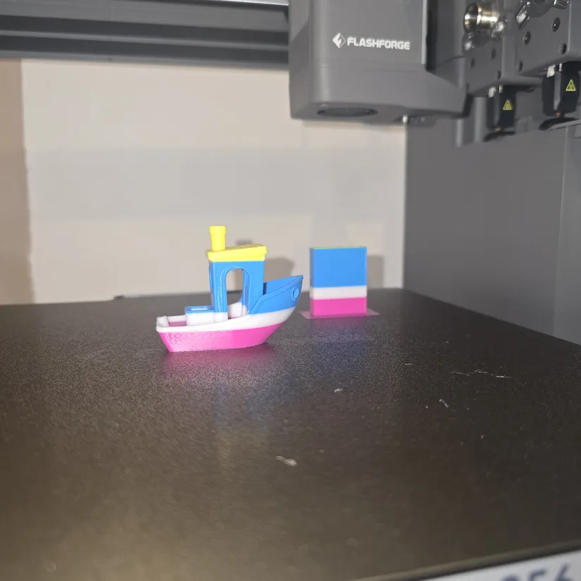 Flashforge Creator 5 four-colour Benchy print Four-colour Benchy printed on the Flashforge Creator 5 build plate