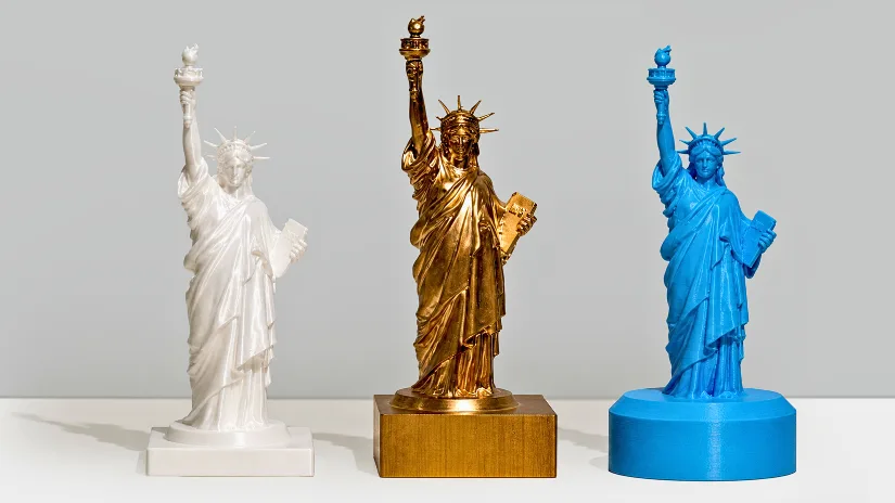 Resin brass and blue wax Statue of Liberty samples made with the InfiMaker K1 desktop 5-axis CNC
