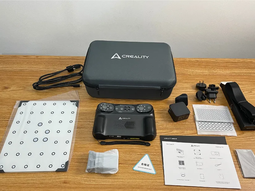 Creality Sermoon P1 package contents including scanner, carrying case, calibration board, markers, power adapters, and accessories.