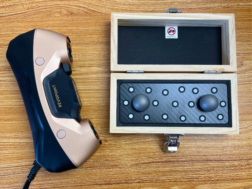 Scanner beside the precision Ball Plate supplied with the CMM Edition