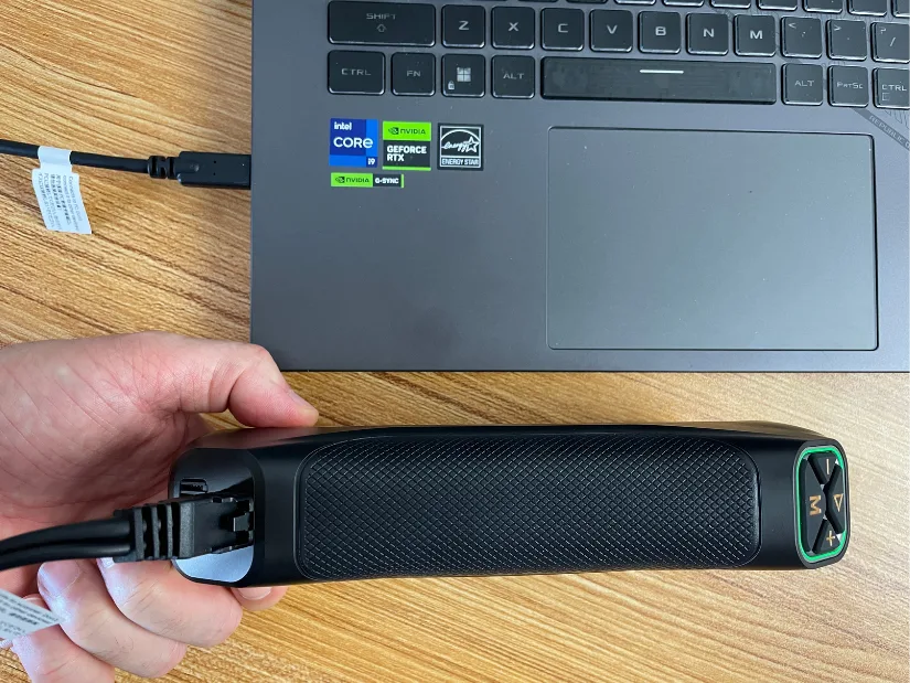 MetroY Ultra connected to a laptop with a USB Type-C cable, showing the textured grip and secure wired connection