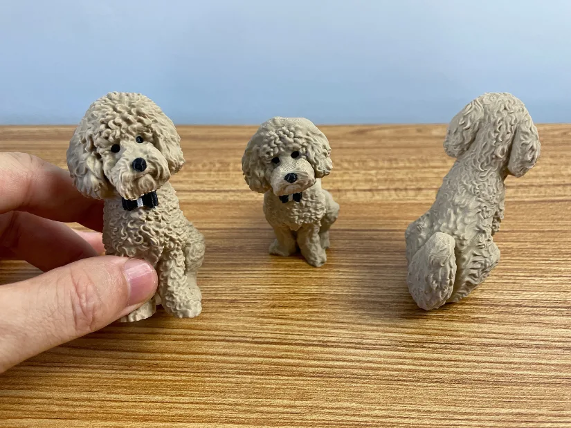 Three 3D printed Teddy dog models showing the Tripo AI generated version and refined versions from the front and back