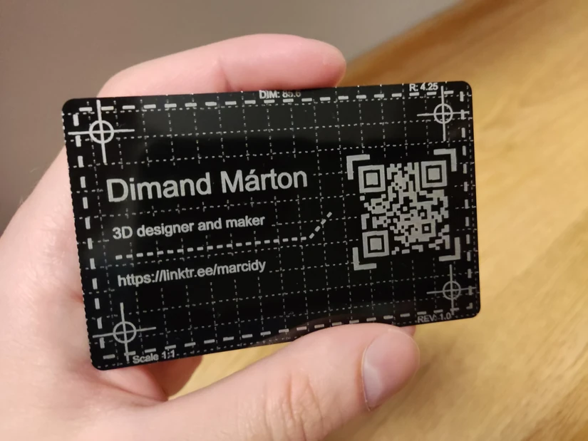 Anodized aluminium business card engraved with the Carverall X1Pro