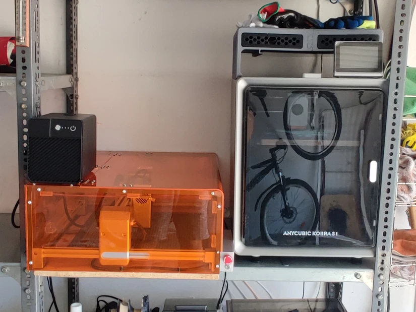 Carverall X1Pro laser engraver setup beside Anycubic Kobra S1