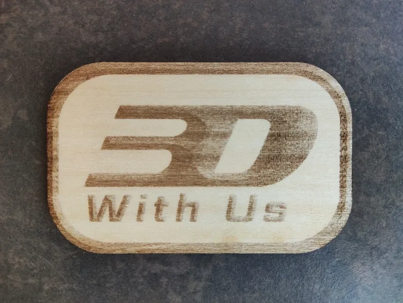3DWithUs logo engraved on plywood with the Carverall X1Pro
